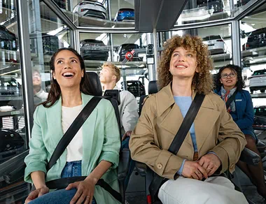 Four people during the tour through the car towers