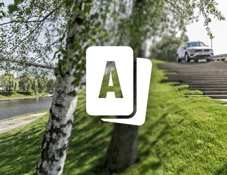 Symbol des Ticketshops der Autostadt, ein Tourag der über Treppen fährt im Hintergrund