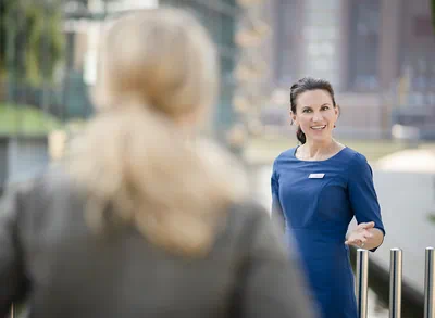 An employee and a guest having a conversation